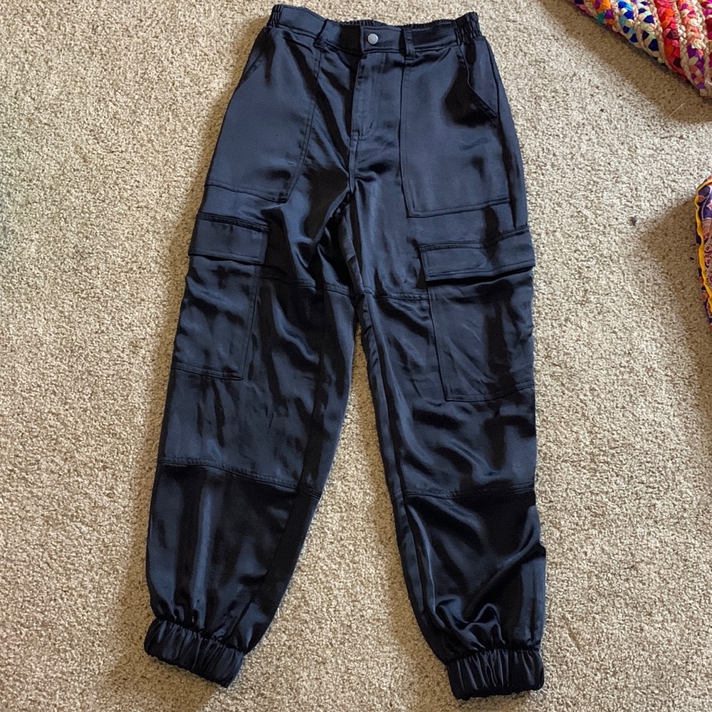 100% polyester pants, black. Very comfy. Wore twice.